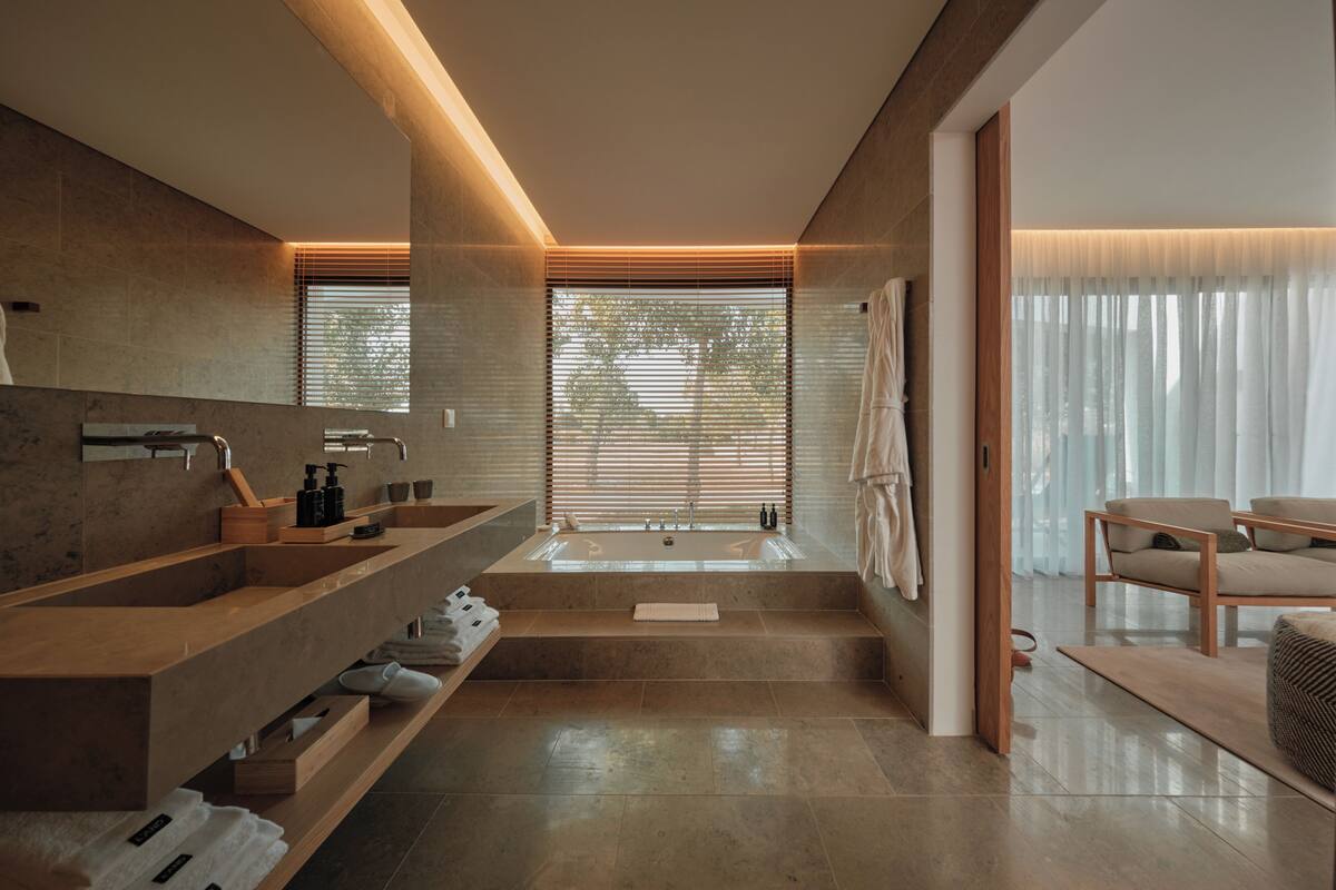 premier studio suite | bathroom | separate bathtub and shower, hair dryer, slippers, towels