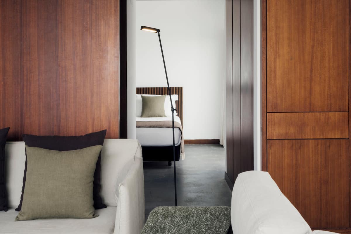 deluxe suite, 2 bedrooms, garden view | living area | 62-inch lcd tv with cable channels, tv, fireplace