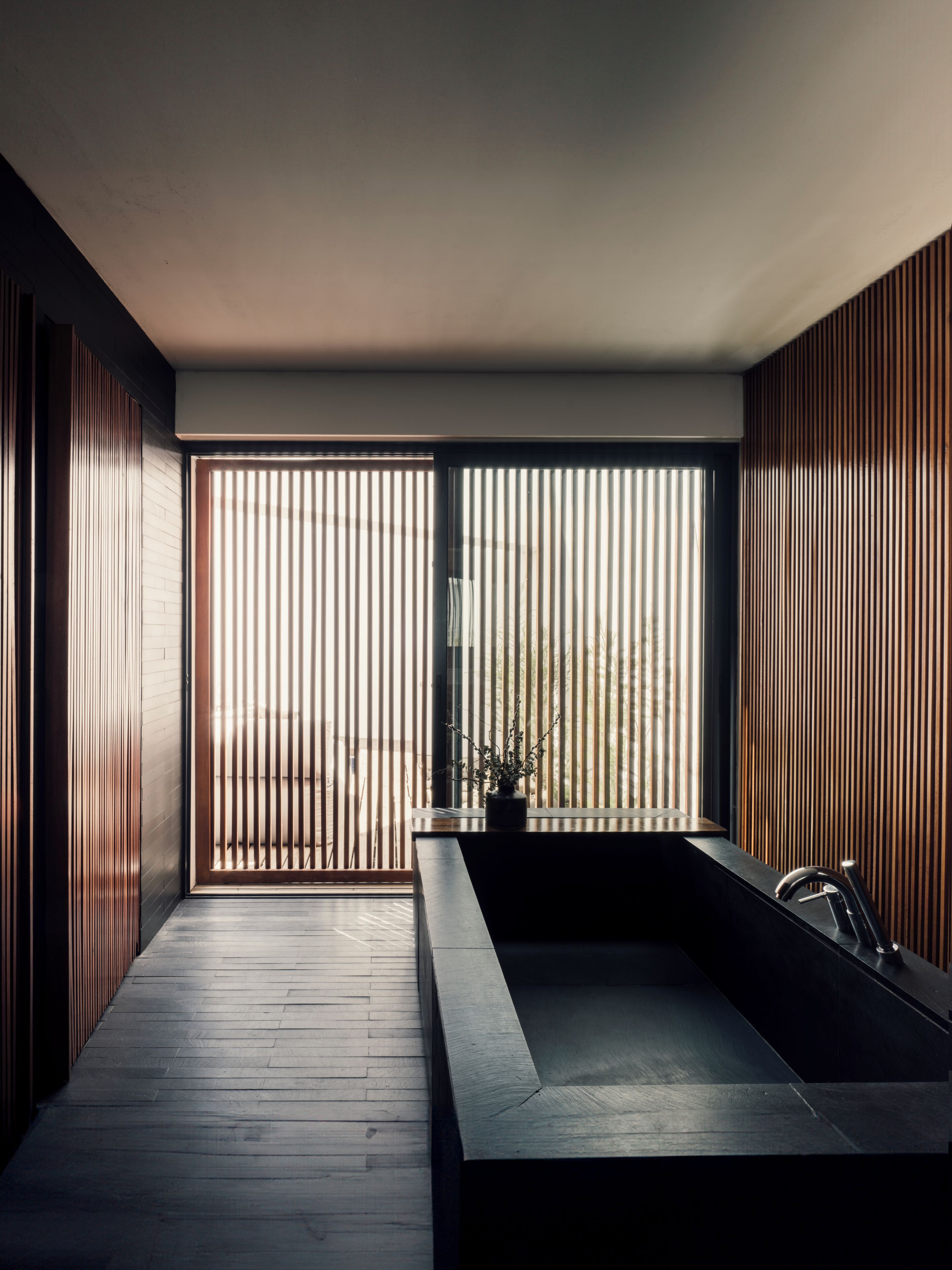 sky view suite | bathroom | separate bathtub and shower, hair dryer, slippers, towels