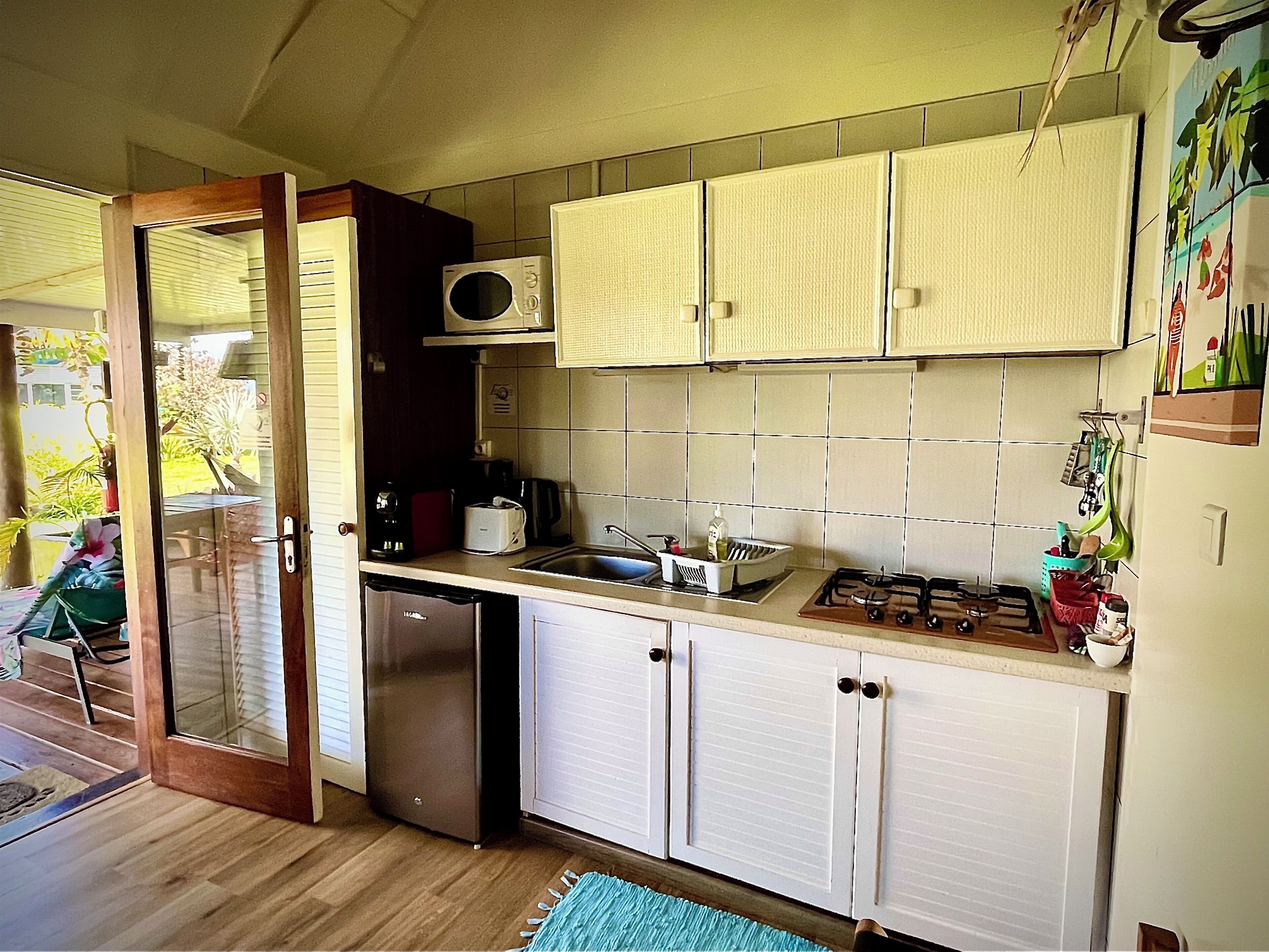 studio, partial sea view, garden area | private kitchen | microwave, stovetop, electric kettle, cookware/dishes/utensils