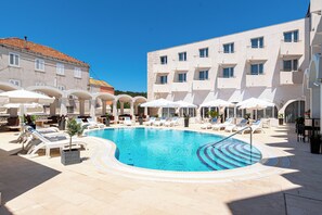 Seasonal outdoor pool, pool umbrellas, pool loungers