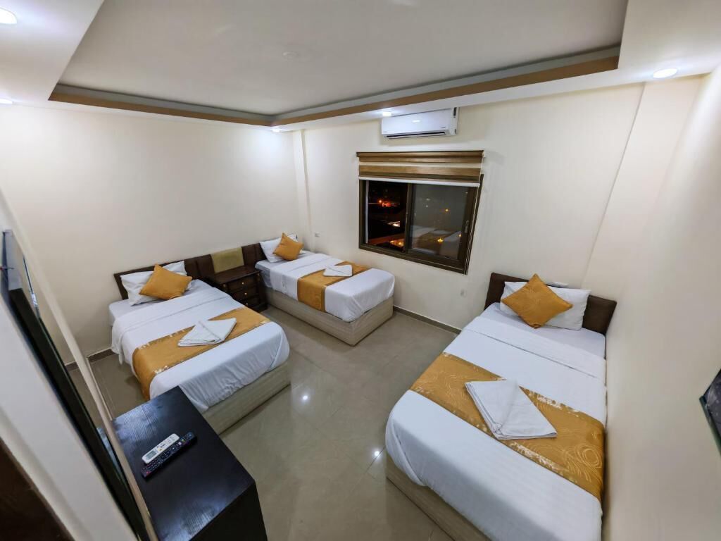 Triple Room | 1 bedroom, Egyptian cotton sheets, pillowtop beds, in-room safe