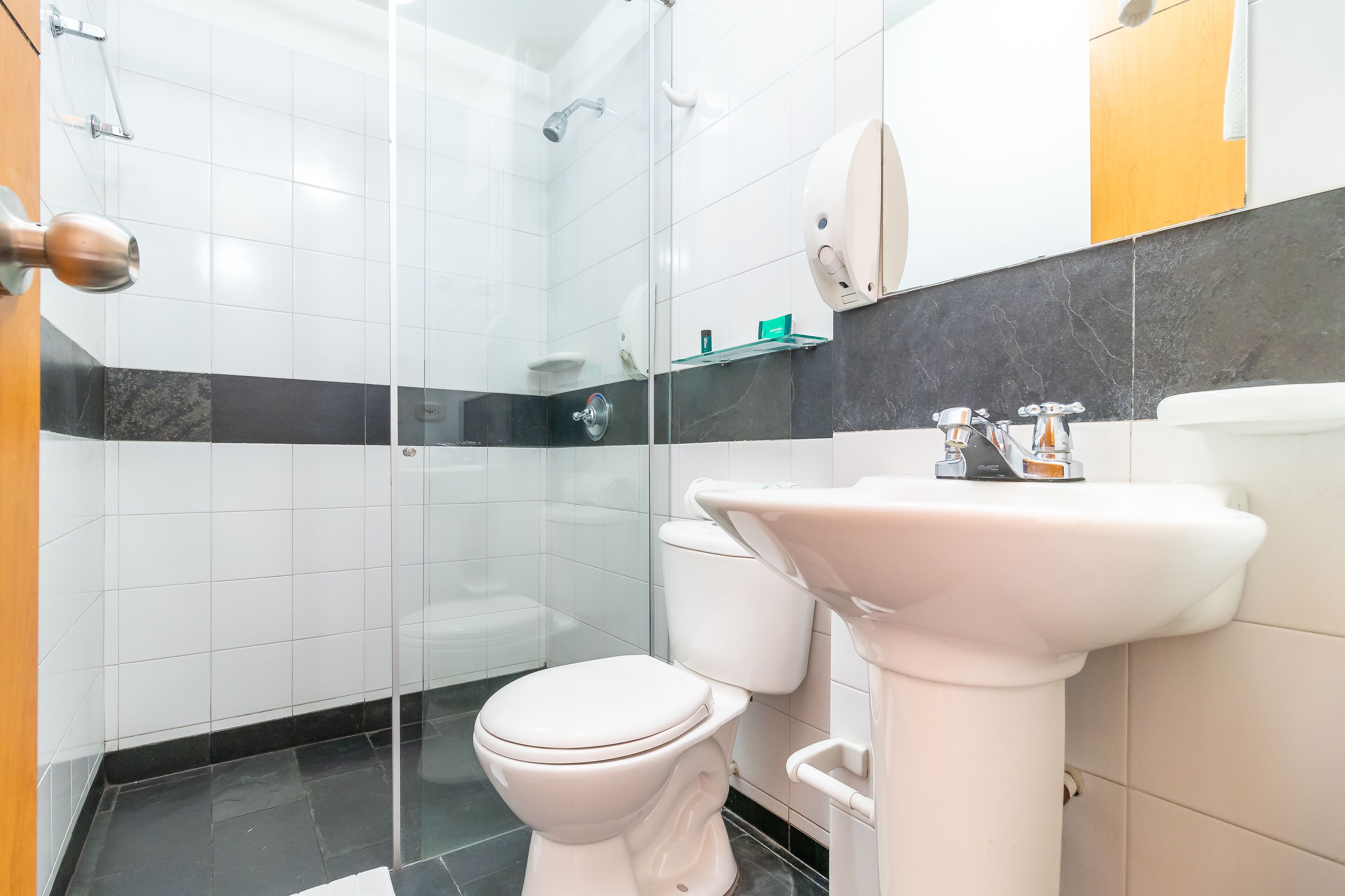 superior single room | bathroom | shower, hair dryer, towels