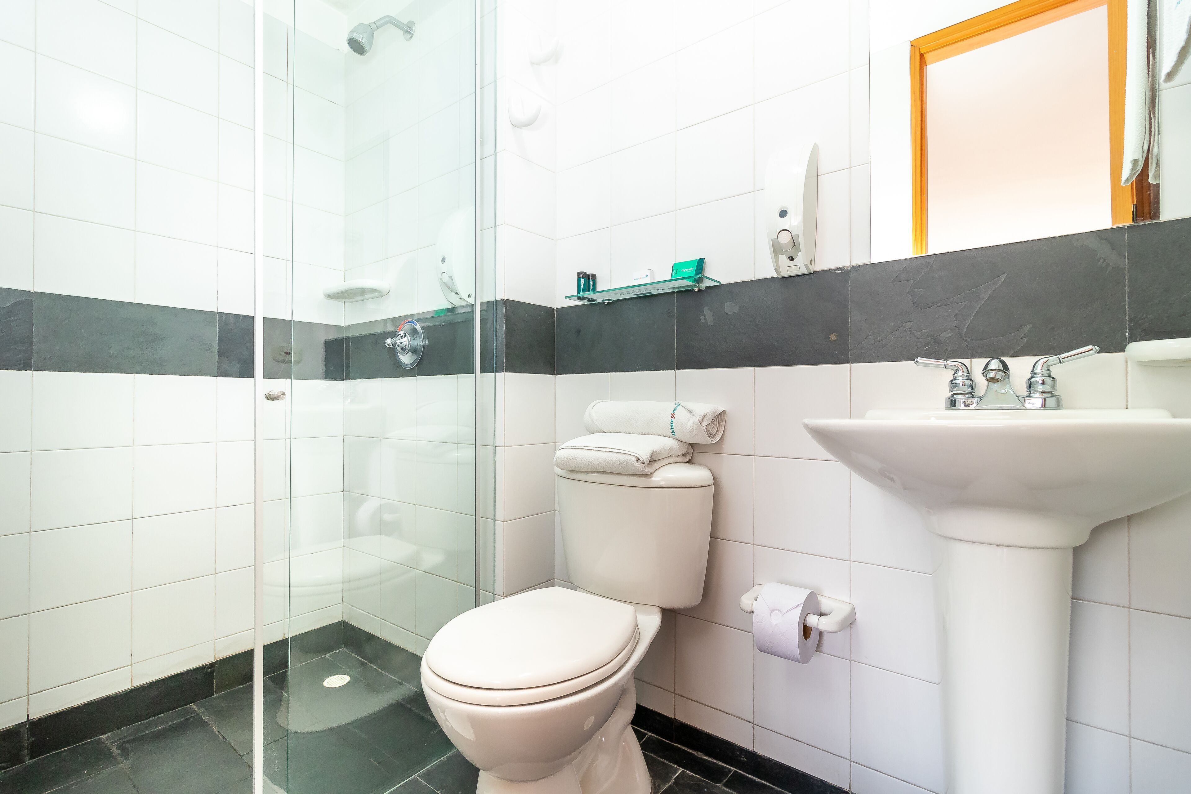 superior triple room | bathroom | shower, hair dryer, towels