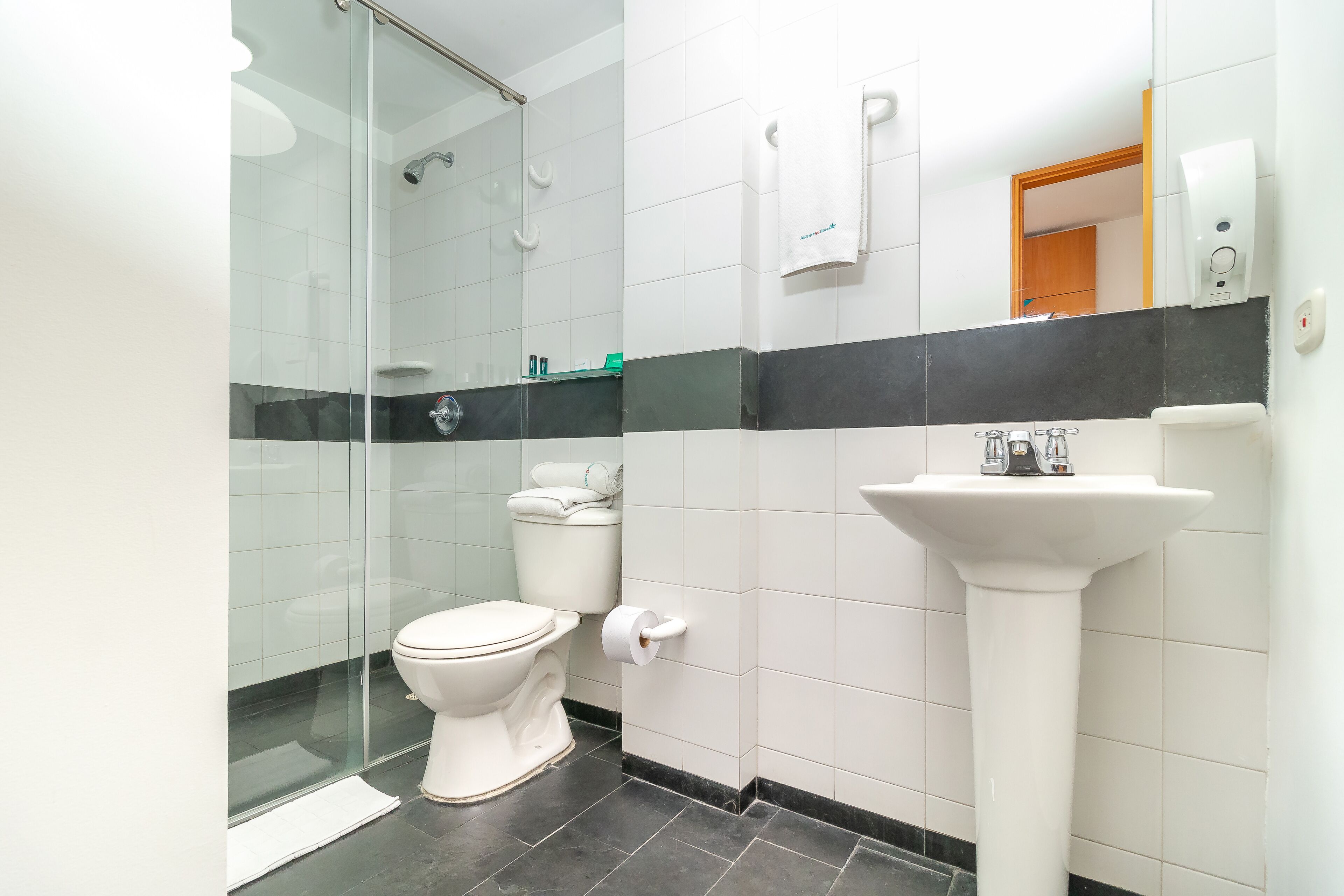 standard double room | bathroom | shower, hair dryer, towels