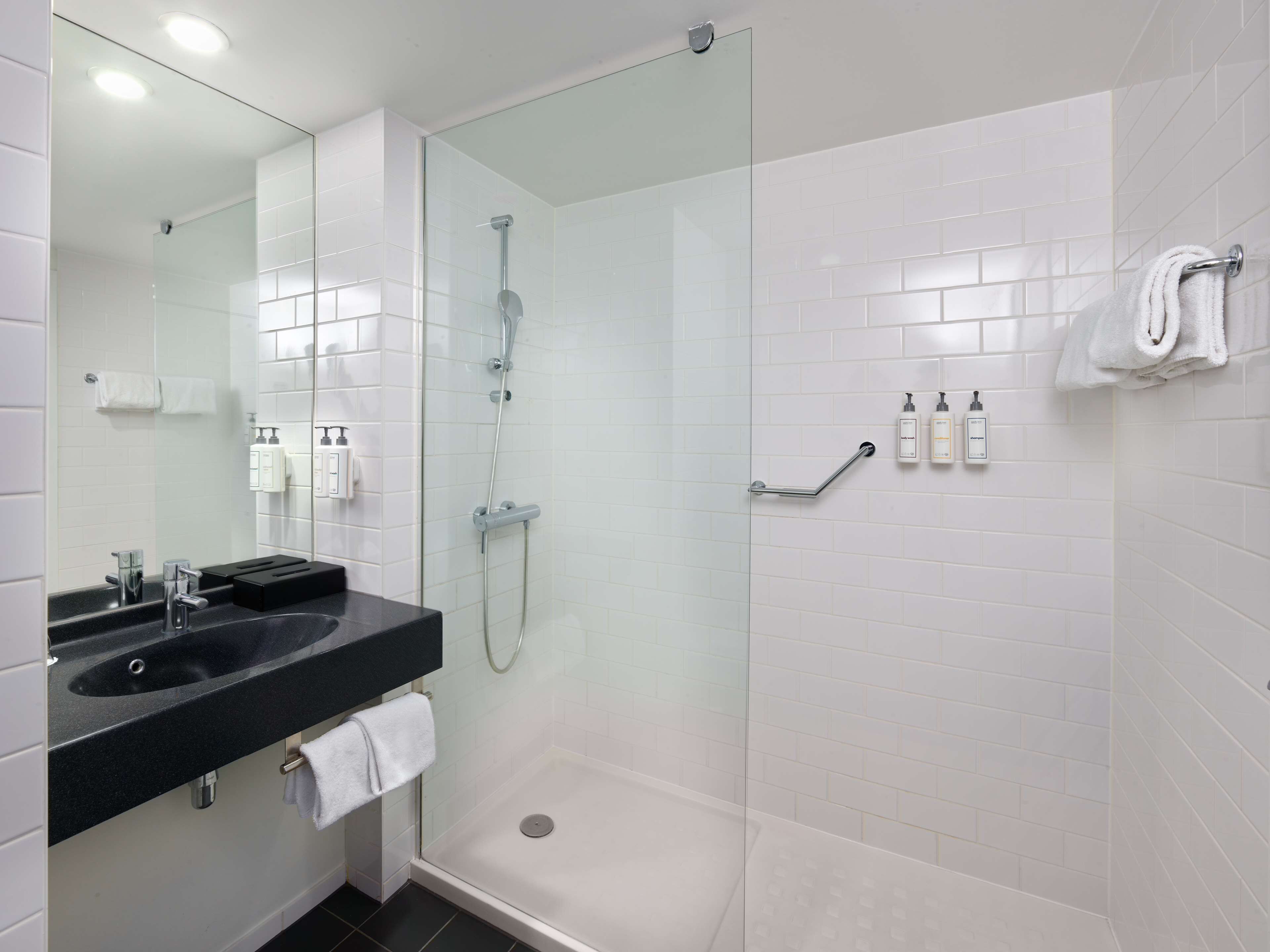 eco-friendly toiletries, hair dryer, towels, soap