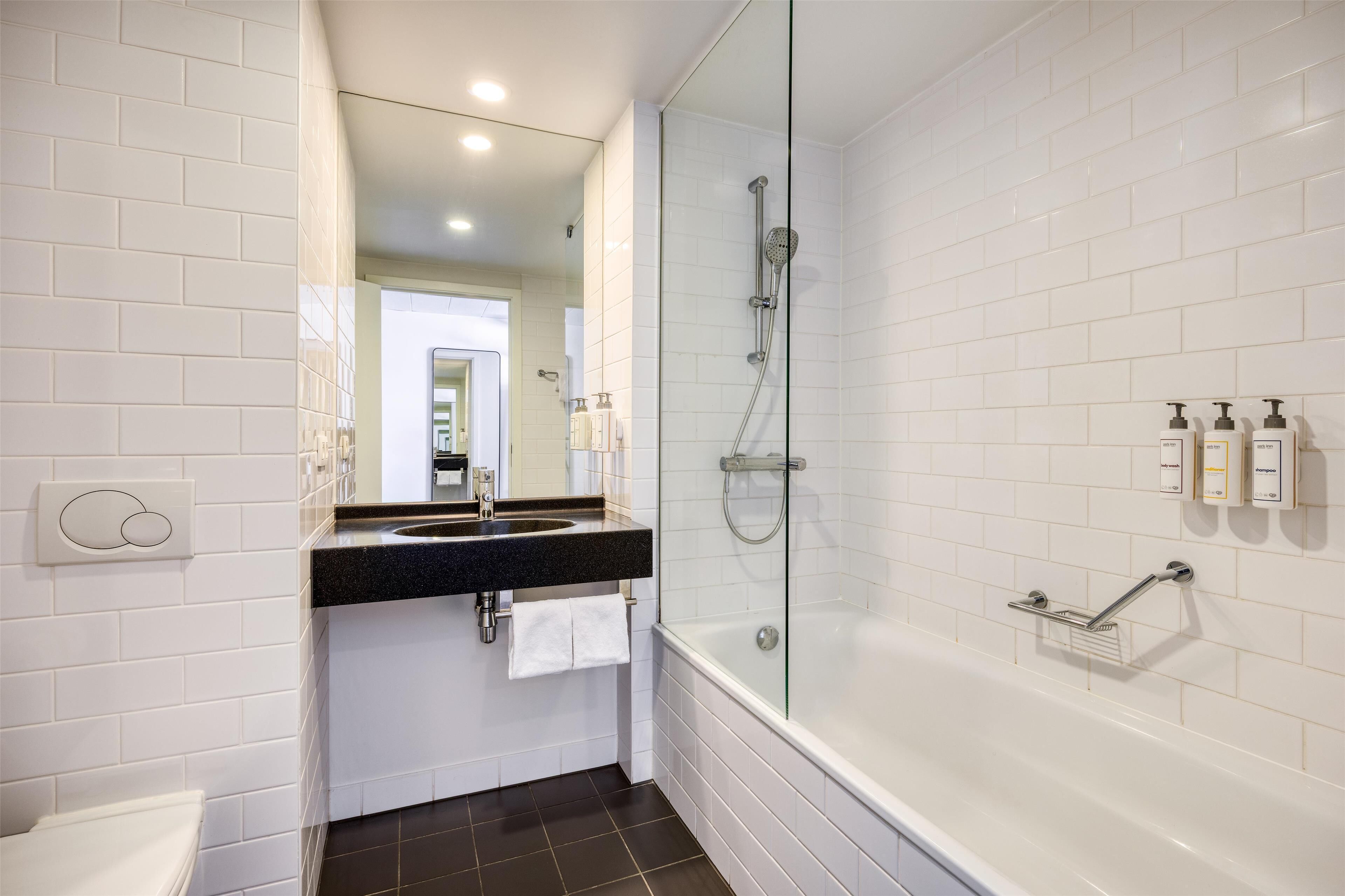 junior suite | bathroom | eco-friendly toiletries, hair dryer, towels, soap