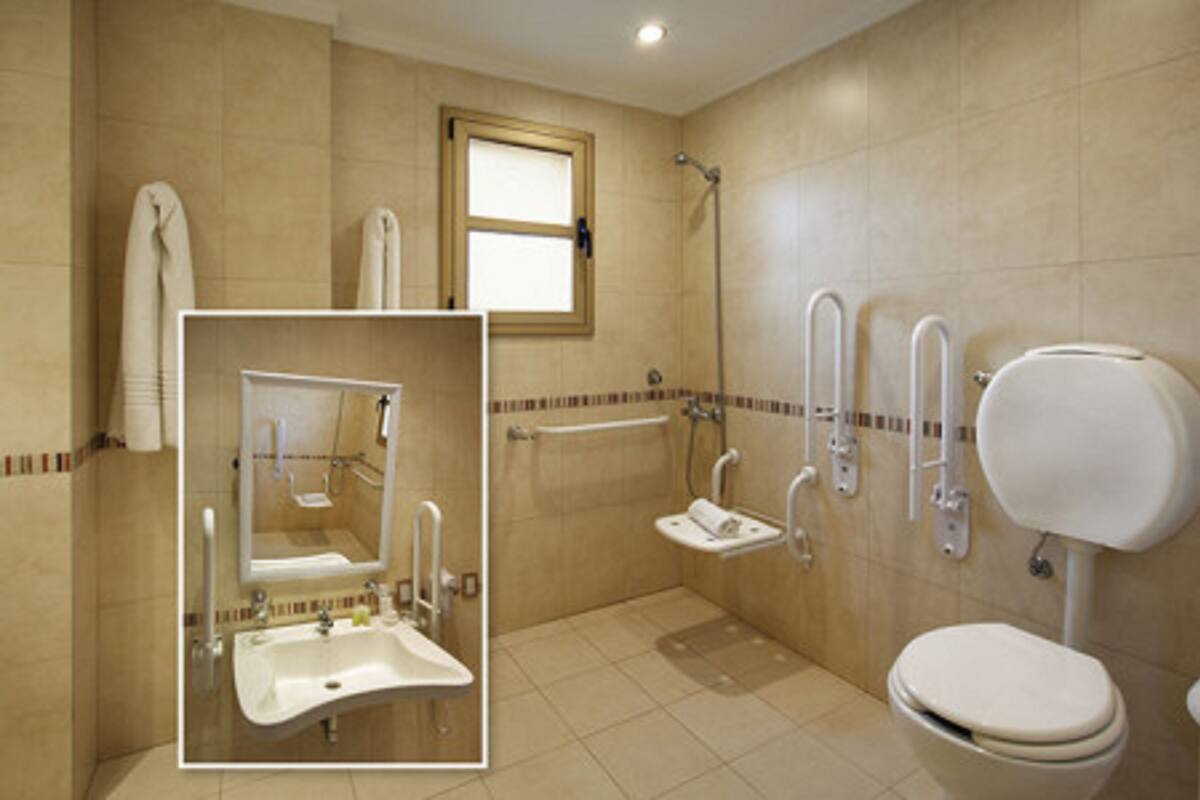 A bathroom with a sink, toilet, and shower.