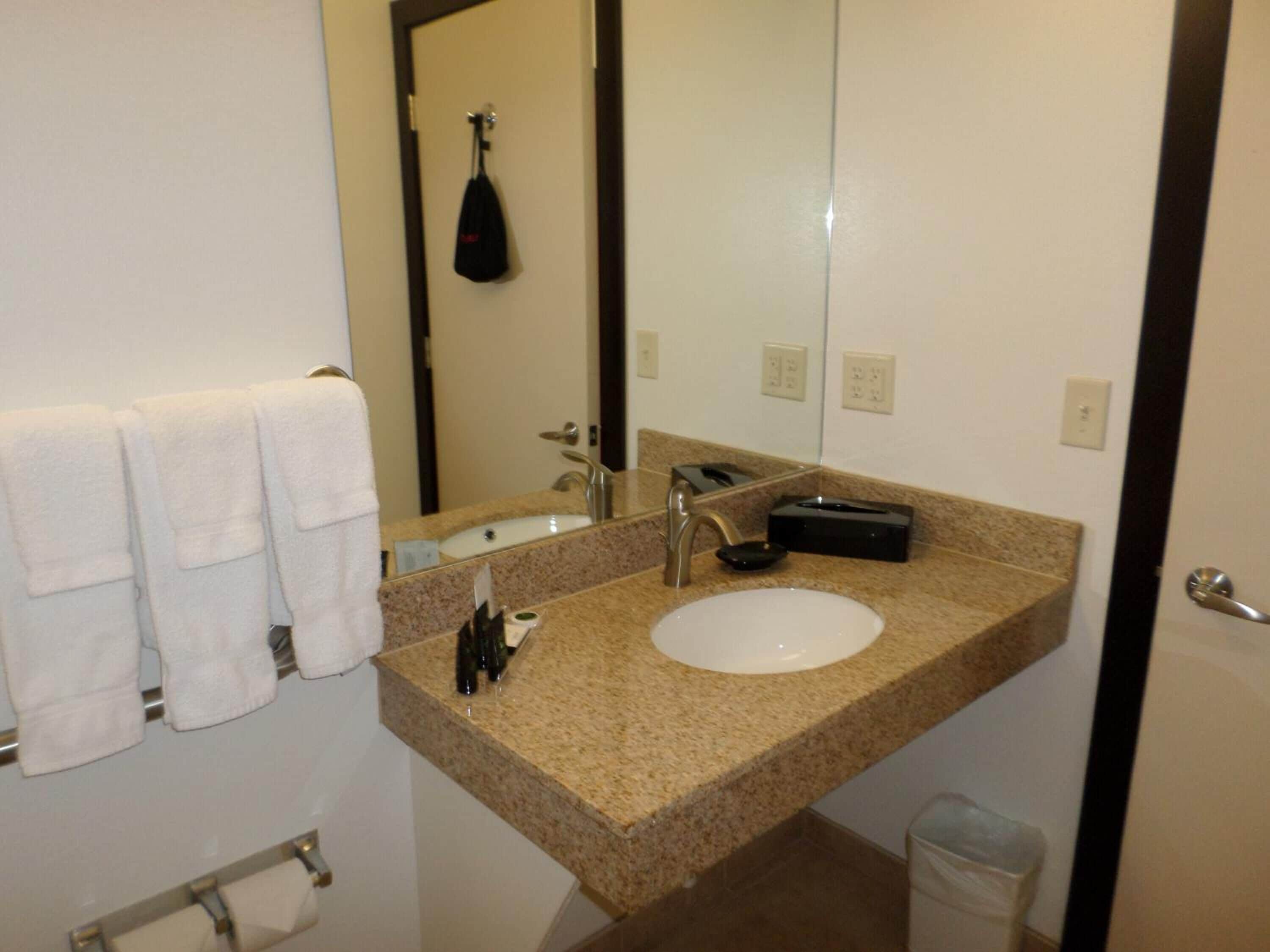 designer toiletries, hair dryer, towels