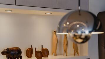 A display of animal figurines on a shelf with a 'Please do not touch' sign.