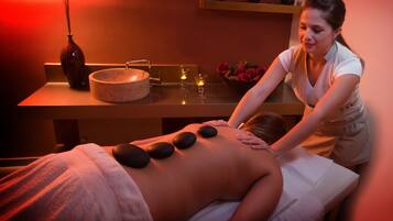 Experience a soothing massage in a serene spa setting, complete with a skilled therapist and calming ambiance.