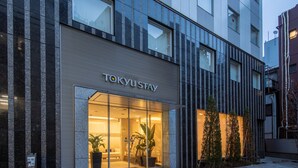 A modern building with a glass entrance labeled "TOKYU STAY". - Tokyu Stay Ikebukuro (Tokyo)