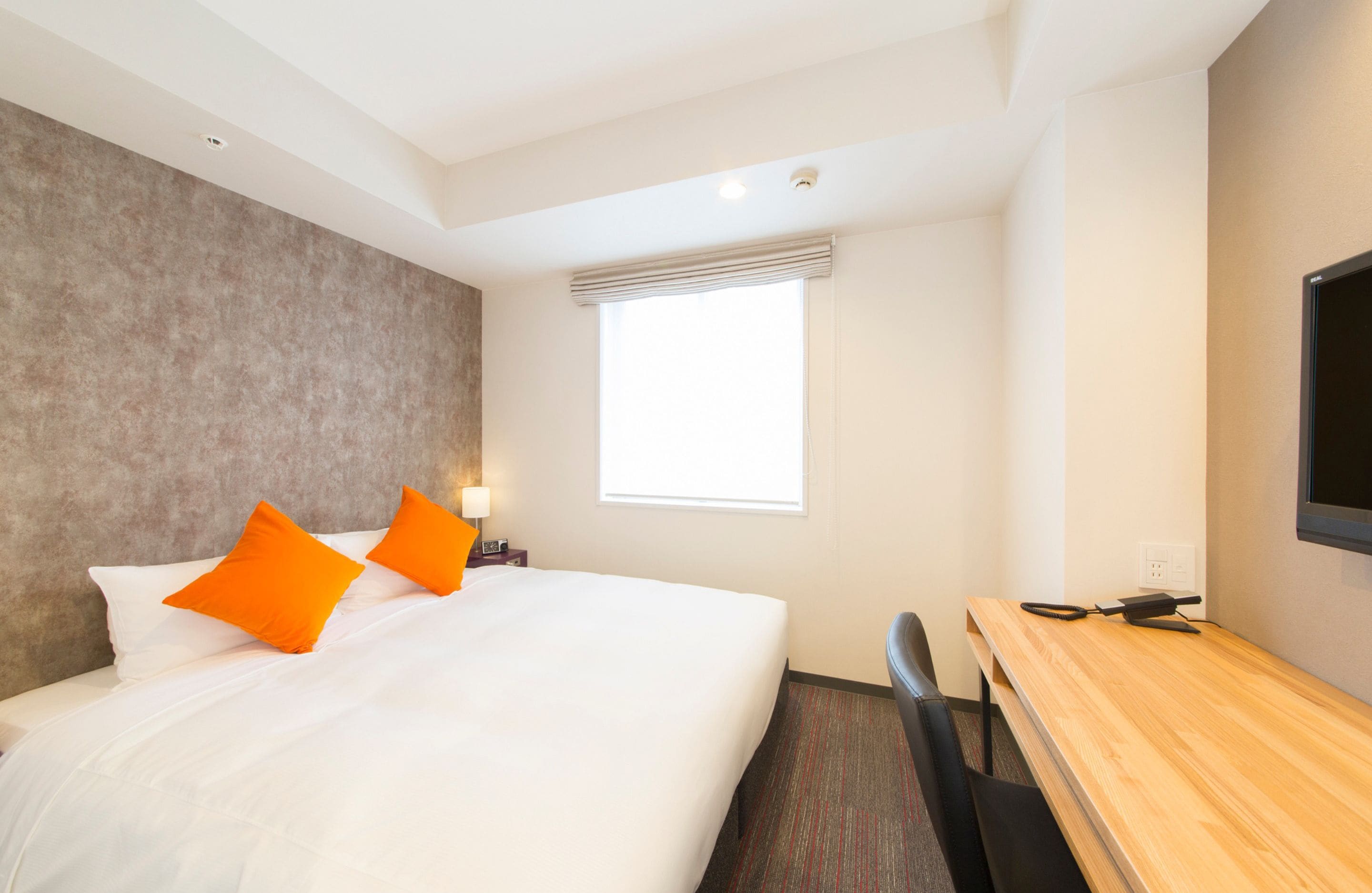 premium bedding, down duvets, memory-foam beds, in-room safe