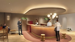 A reception area with a curved counter, seating, and a tiled floor. - Tokyu Stay Gotanda (Tokyo)