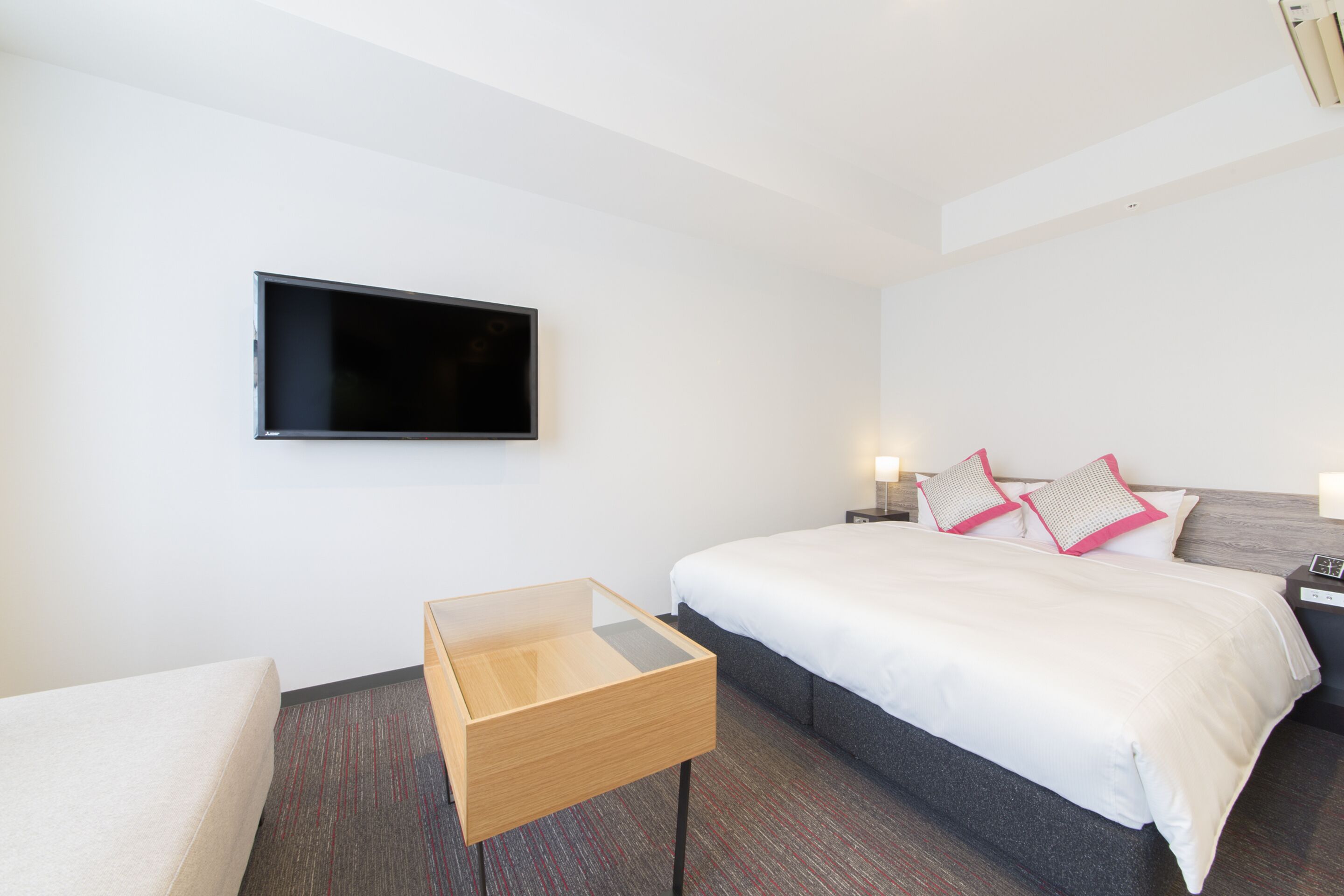 premium bedding, down duvets, memory-foam beds, in-room safe