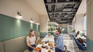 A modern restaurant interior with booths, a bar area, and a casual dining setup. - Tokyu Stay Gotanda (Tokyo)