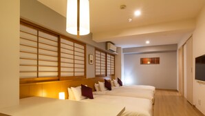 A hotel room with two beds, a wooden table, chairs, a wall-mounted TV, and a sliding door. - Tokyu Stay Monzen Nakacho Tokyo (Tokyo)