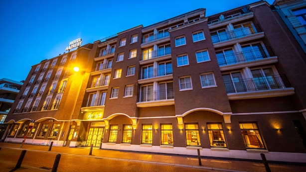 A multi-story hotel with a prominent sign reading "HOTEL AZAERT."