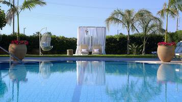 Seasonal outdoor pool, pool umbrellas, sun loungers