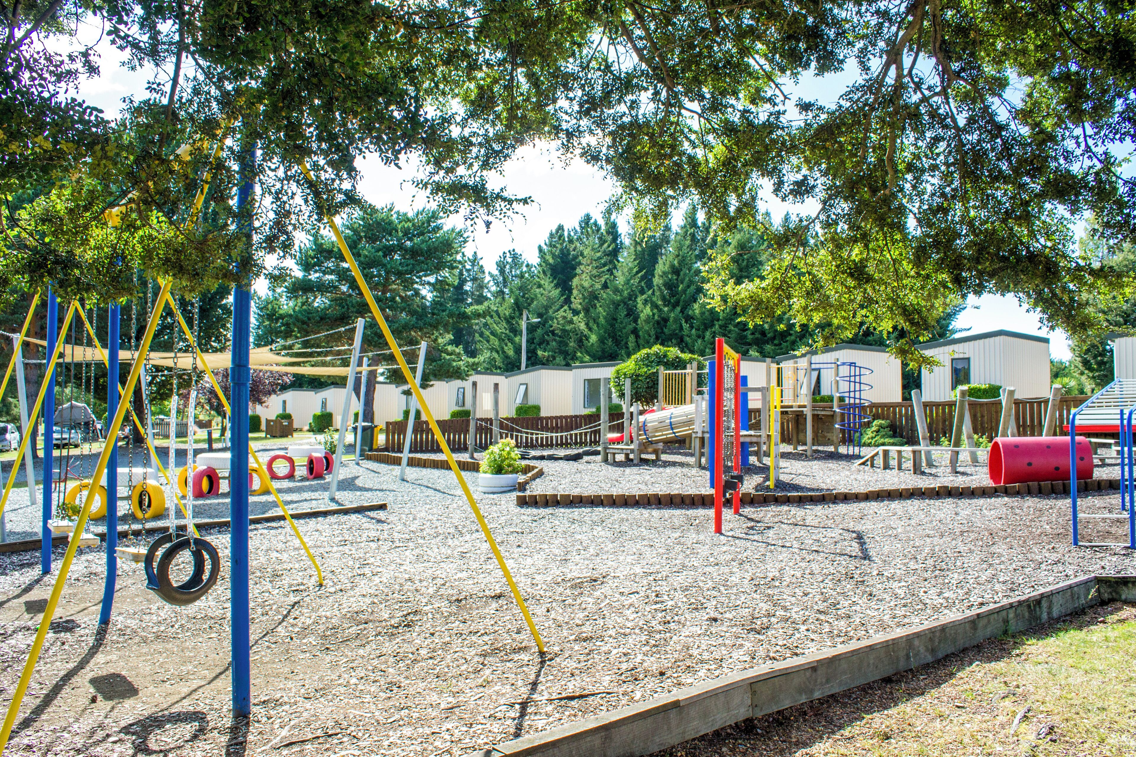 A playground with swings, slides, and climbing structures.