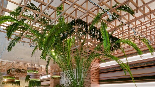 A spacious indoor area with wooden flooring, green upholstered chairs, and tables. - Park House Hotel (Kryvyi Rih)