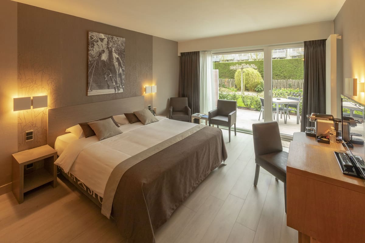 superior double room | in-room safe, desk, laptop workspace, blackout curtains