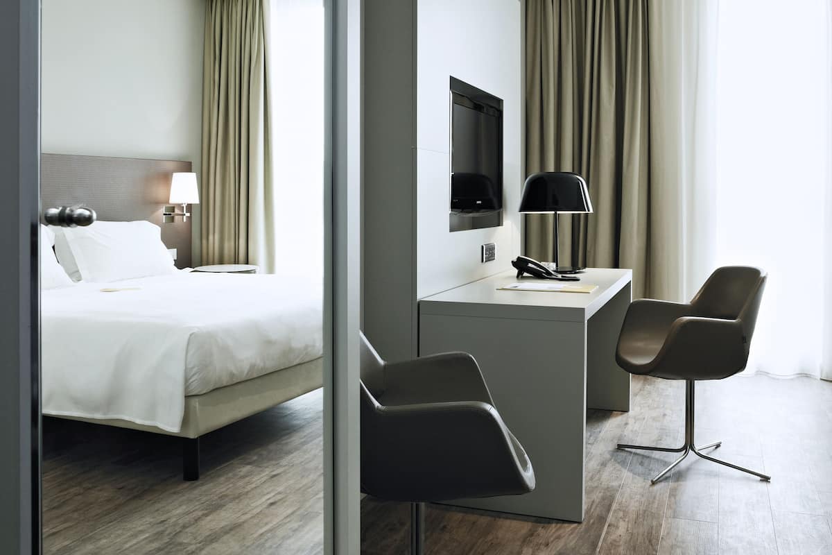 Family Room | 1 bedroom, in-room safe, desk, blackout curtains