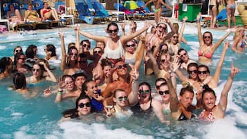 Seasonal outdoor pool, open 9:00 AM to 9:00 PM, pool umbrellas