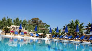 Seasonal outdoor pool, open 9:00 AM to 9:00 PM, pool umbrellas