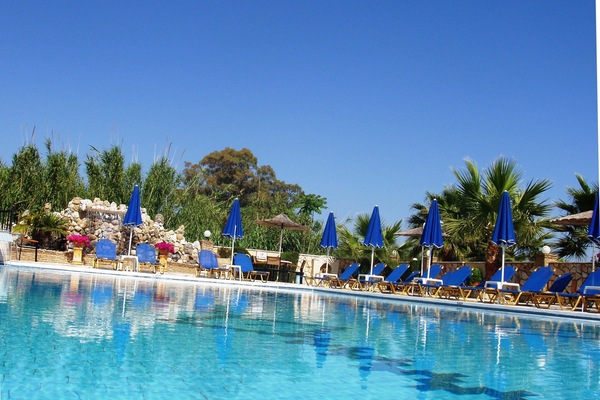 Seasonal outdoor pool, open 9:00 AM to 9:00 PM, pool umbrellas
