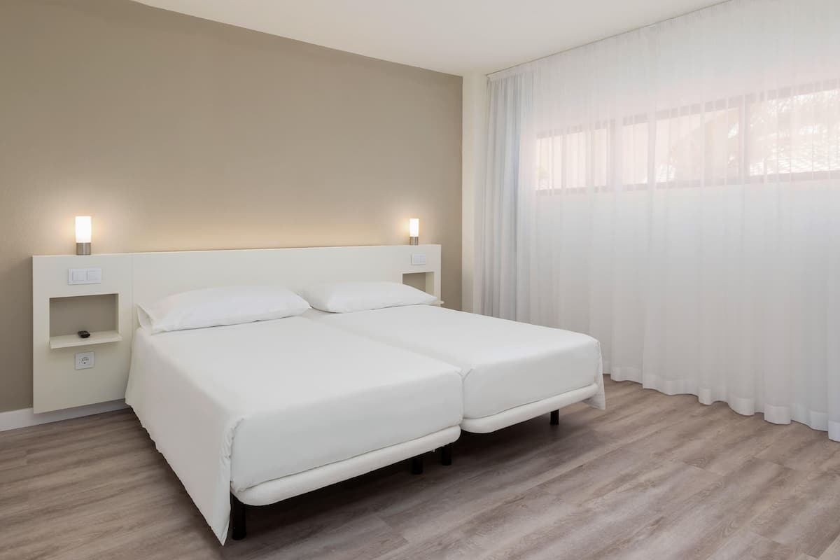 Desk, blackout drapes, cribs (free), WiFi (free)