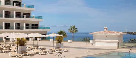 Outdoor pool, pool umbrellas, pool loungers