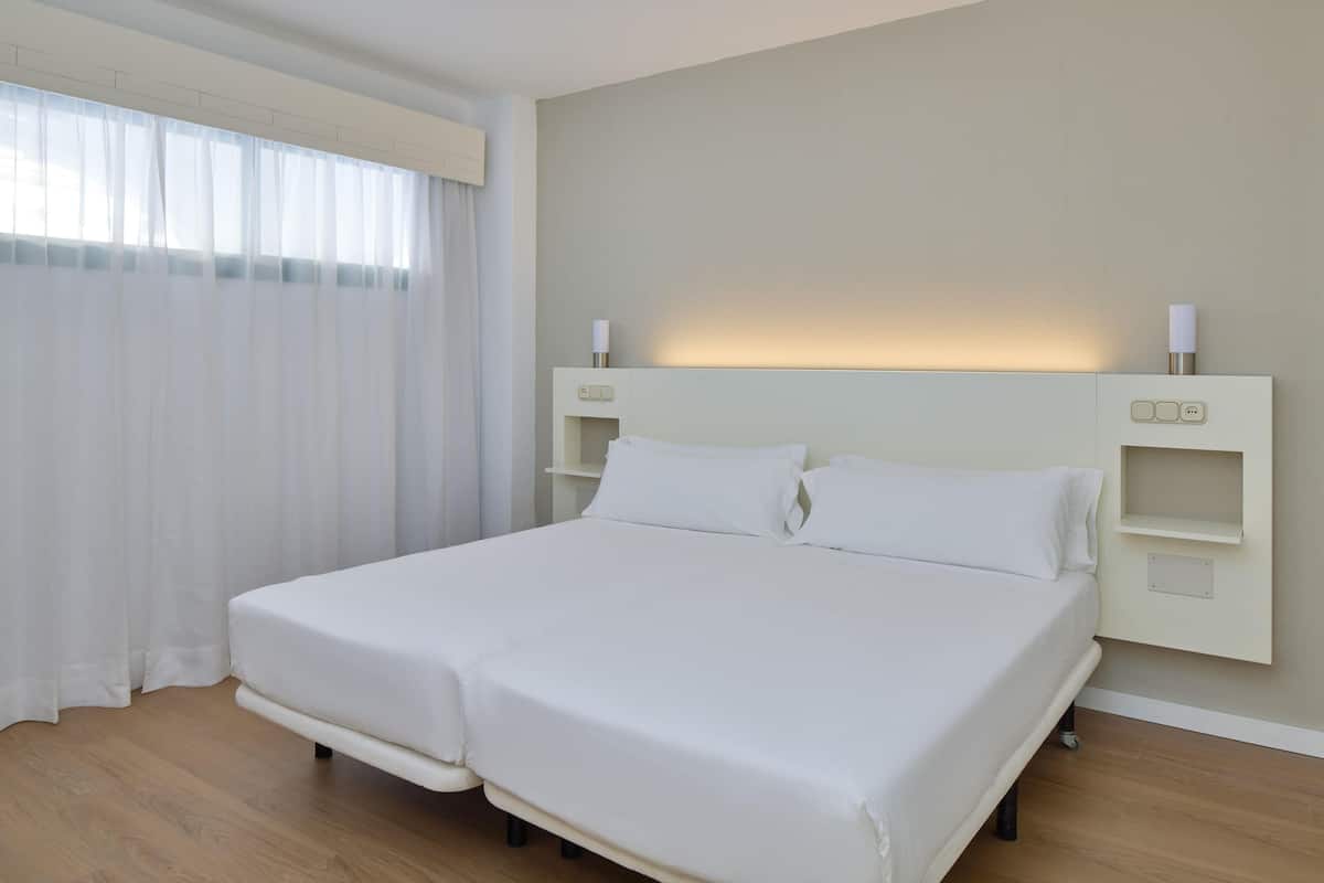 Desk, blackout drapes, cribs (free), WiFi (free)