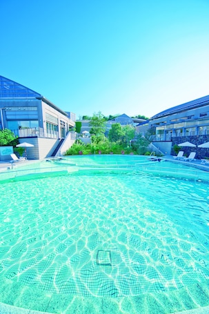 Indoor pool, seasonal outdoor pool. Miyako Resort Okushima Aqua Forest