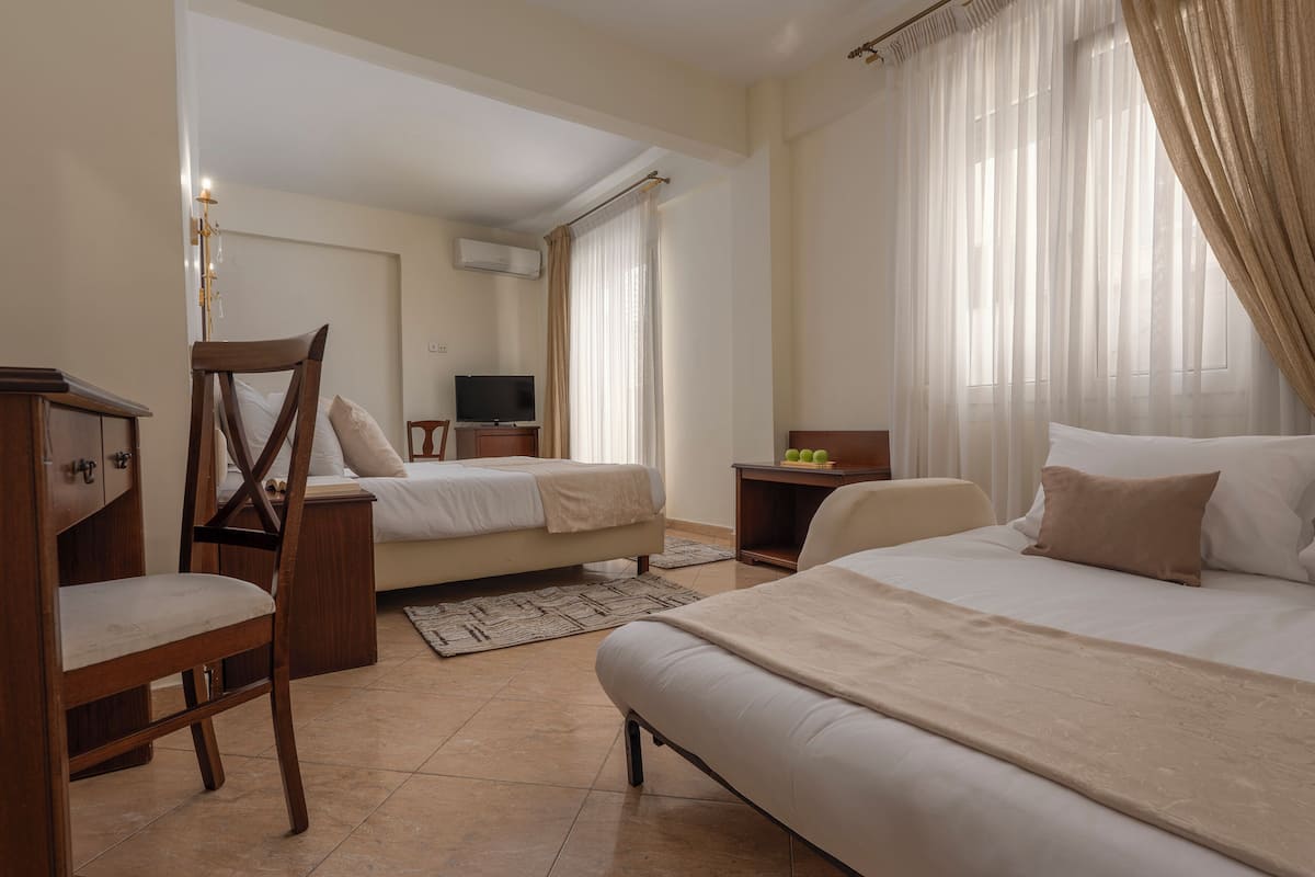 Family Room with Balcony | Egyptian cotton sheets, premium bedding, pillowtop beds, minibar