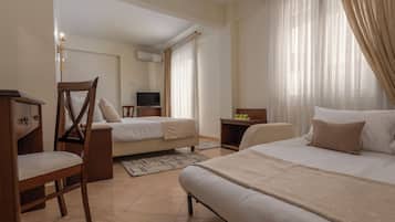 Family Room with Balcony | Egyptian cotton sheets, premium bedding, pillowtop beds, minibar