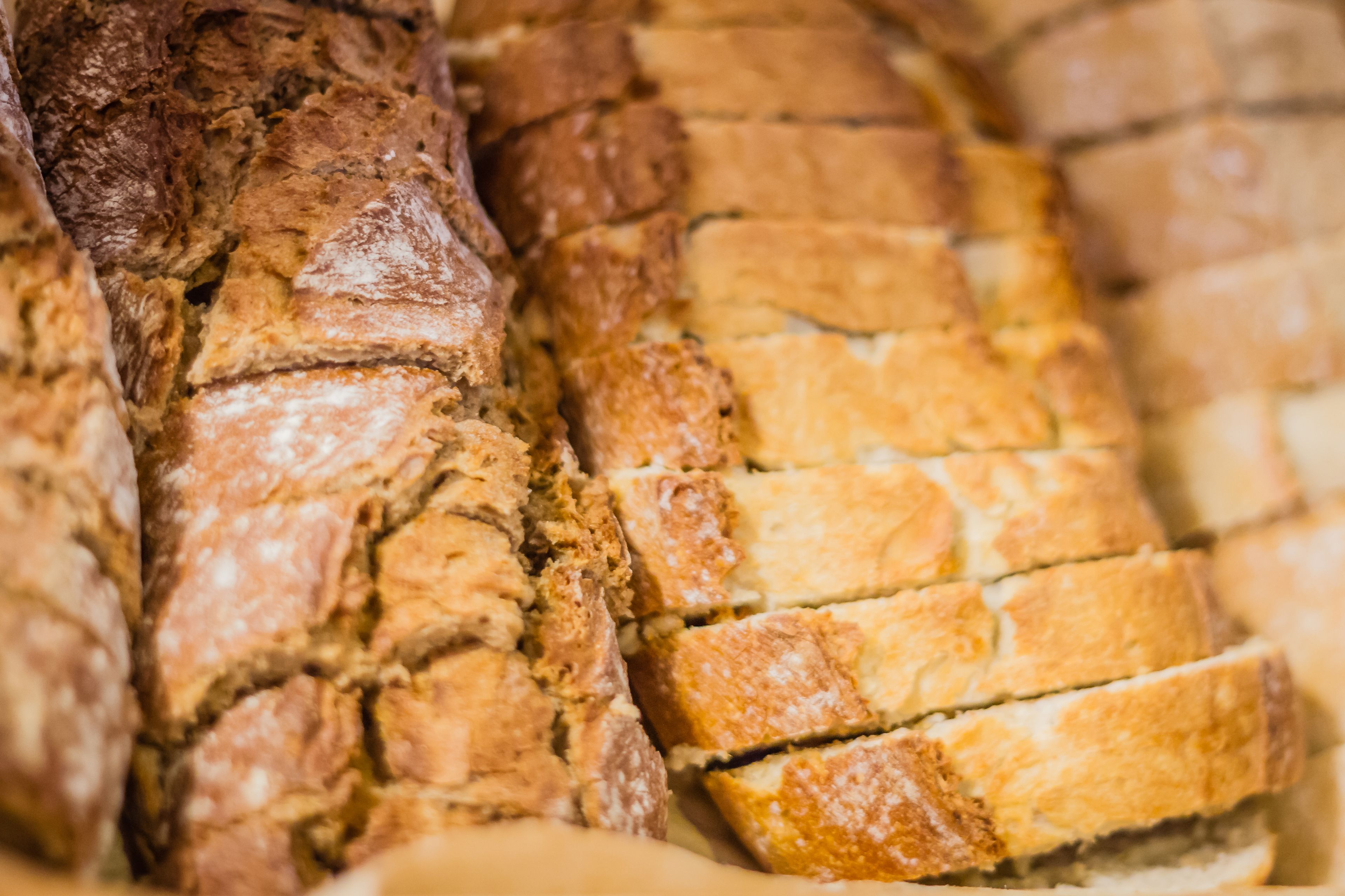 A loaf of bread with a crusty exterior and a soft, airy interior.