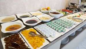 A buffet with various food items and condiments. - Mira Otel Alsancak (Izmir)