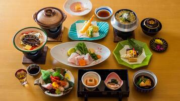 A variety of Japanese dishes arranged on a wooden table.