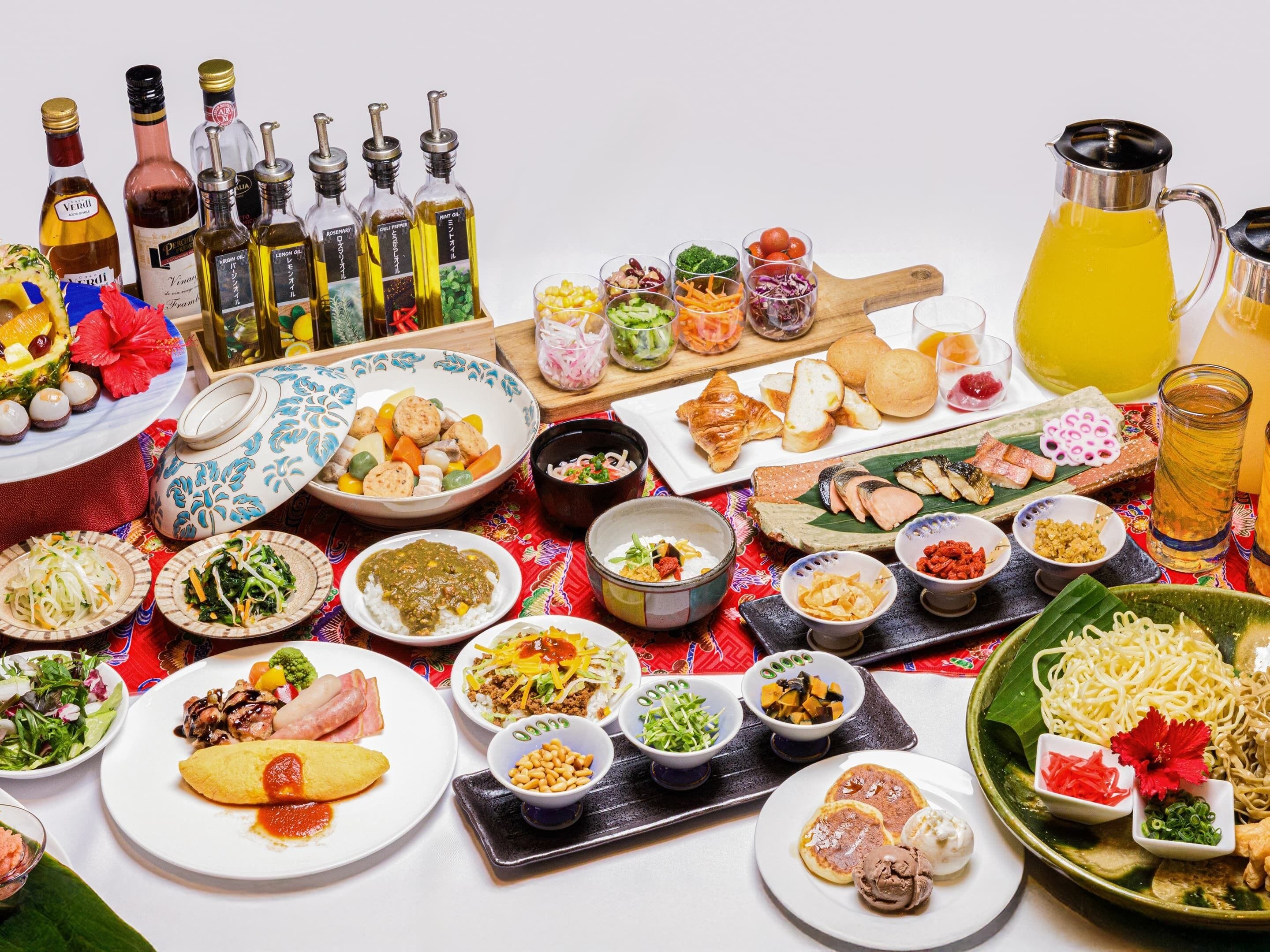 A table with various dishes, condiments, and beverages.