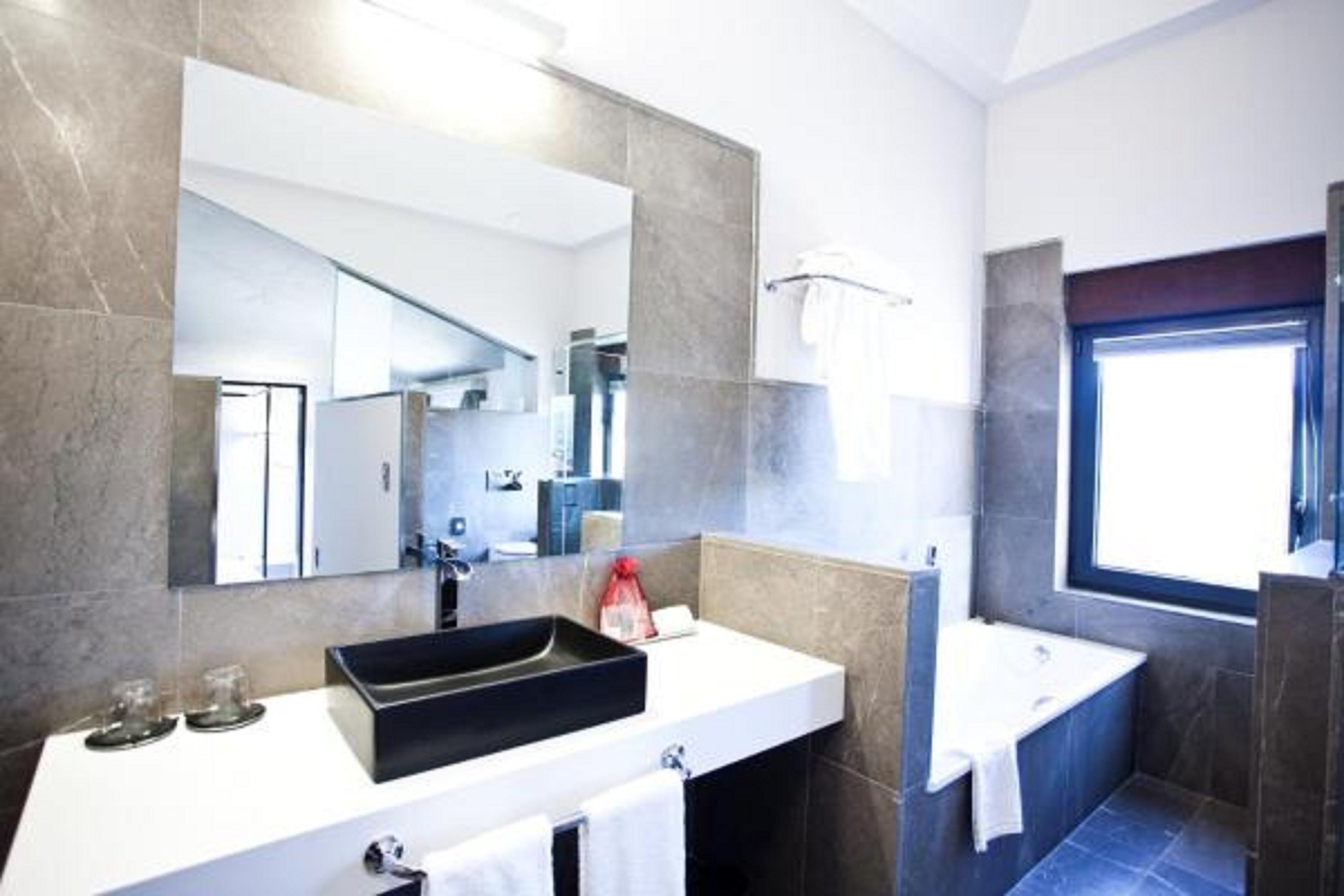 designer toiletries, hair dryer, bathrobes, bidet