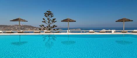 Outdoor pool, pool umbrellas, sun loungers