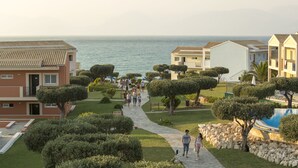 A coastal residential area with a pathway leading to a beach.