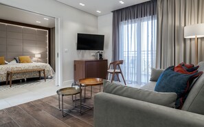 Luxury Suite, 2 Bedrooms | Living area | TV, table tennis, books