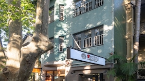 A two-story building with a sign for 'Highfield' and a visible entrance. - Highfield Hotel (Potts Point)