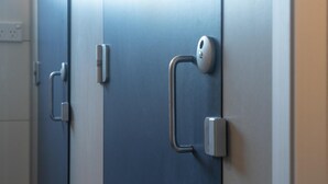 A set of doors with a modern handle design, likely part of a hotel or similar accommodation. - Highfield Hotel (Potts Point)