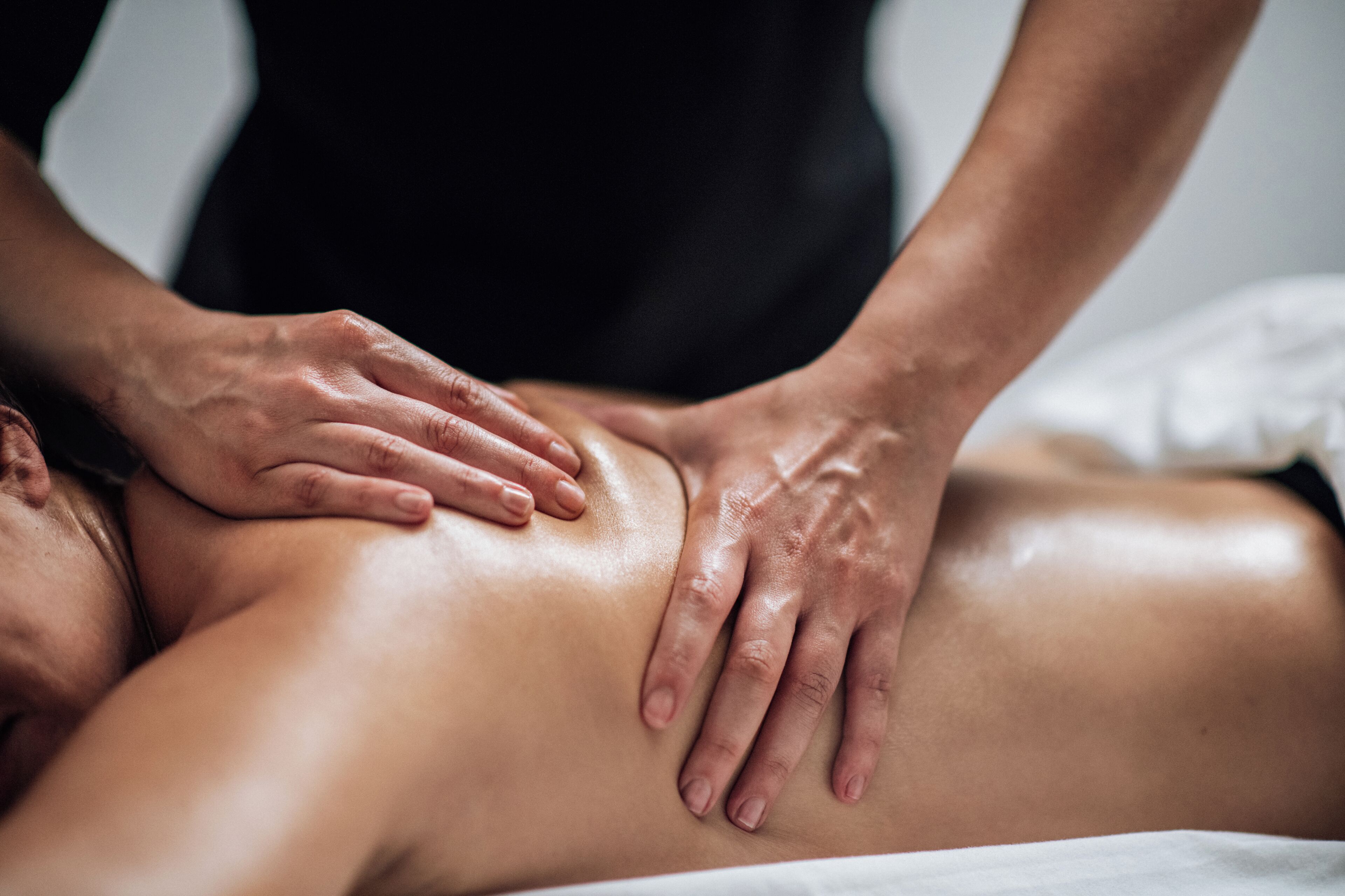 A person receiving a back massage.