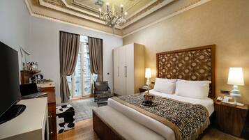 Premium bedding, down comforters, minibar, in-room safe