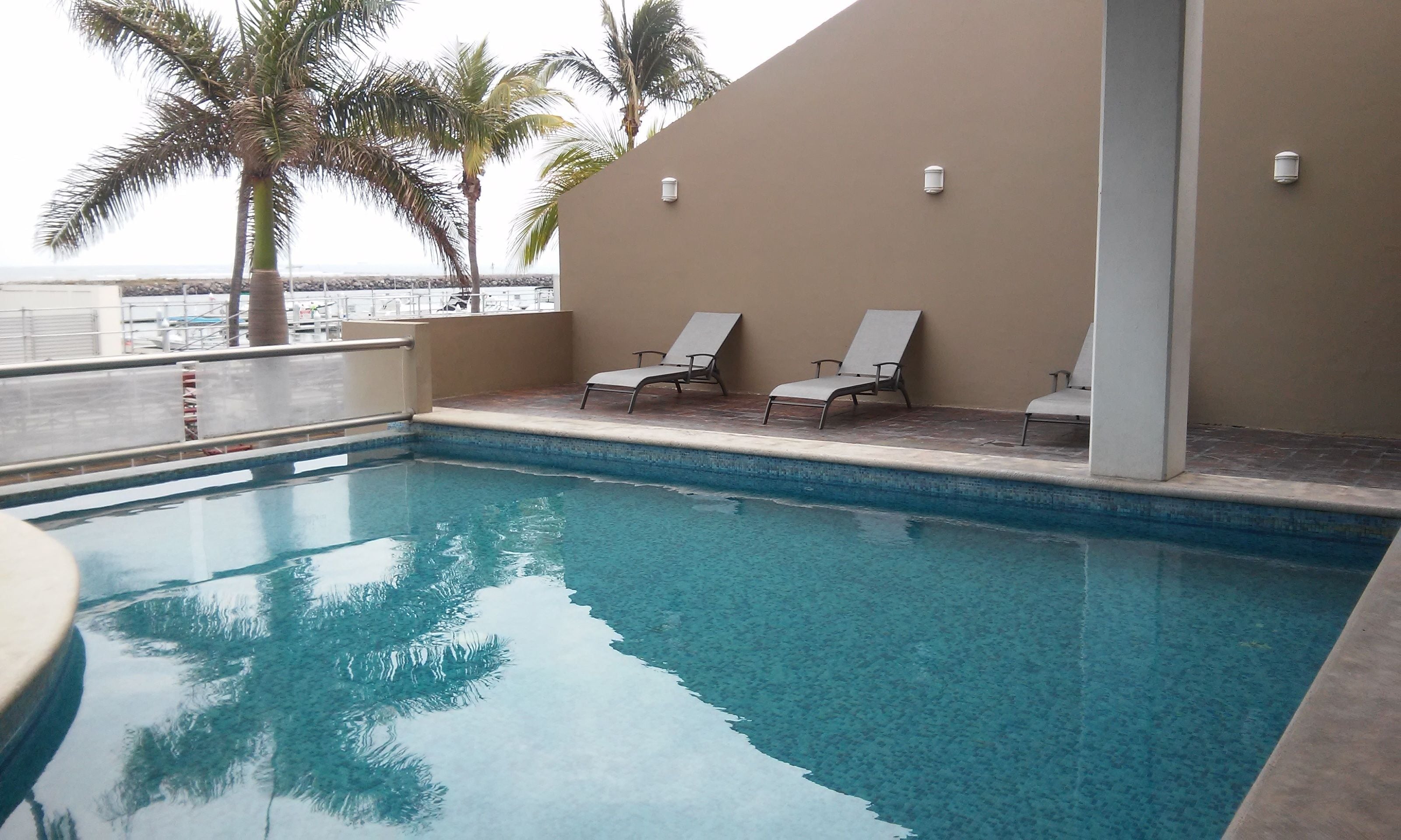 outdoor pool, open 7 am to 10:30 pm, pool loungers