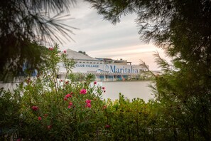 A hotel named Maritalia with a white facade and a balcony overlooking a body of water. - Maritalia Hotel Club Village - All Inclusive (Peschici)